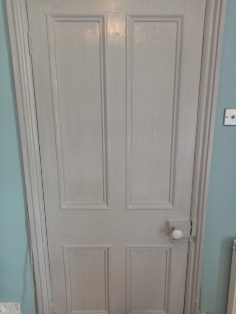 Wooden door painted white